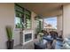 Inviting patio with cozy seating, electric fireplace, and plants at 1 Hughes Center Dr # 308, Las Vegas, NV 89169