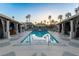 Stunning swimming pool surrounded by cabanas and palm trees, offering a luxurious outdoor experience at 1 Hughes Center Dr # 308, Las Vegas, NV 89169