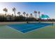 Well-maintained tennis court with clear blue surface and vibrant green surroundings, perfect for recreation at 1 Hughes Center Dr # 308, Las Vegas, NV 89169