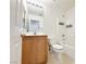 Bathroom showcasing a vanity, toilet, and a bathtub with white tiles at 11036 Parete Ct, Las Vegas, NV 89141