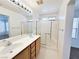Bathroom features a double sink vanity and walk-in glass shower at 11036 Parete Ct, Las Vegas, NV 89141