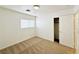 Bright bedroom offers a closet and carpeted flooring at 11036 Parete Ct, Las Vegas, NV 89141