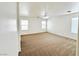 Spacious bedroom filled with natural light from three windows and neutral-toned carpet at 11036 Parete Ct, Las Vegas, NV 89141