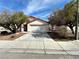 Inviting single-story home featuring a spacious driveway and low maintenance landscaping at 11036 Parete Ct, Las Vegas, NV 89141