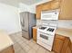 This kitchen features stainless steel appliances and wooden cabinets at 11036 Parete Ct, Las Vegas, NV 89141