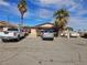 Exterior shot of a single-story home featuring a large driveway, ideal for multiple vehicles and easy access at 1608 Putnam Ave, North Las Vegas, NV 89030