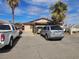 Single-story home with a large driveway, showcasing ample parking space and convenient access at 1608 Putnam Ave, North Las Vegas, NV 89030