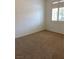 Neutral-toned bedroom with plush carpeting and window with natural light at 1742 Franklin Chase Ter, Henderson, NV 89012
