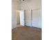 Spacious bedroom with sliding closet doors and view into other rooms at 1742 Franklin Chase Ter, Henderson, NV 89012