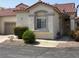 Charming home exterior with a tile roof, manicured landscaping, and a private garage entrance at 1742 Franklin Chase Ter, Henderson, NV 89012