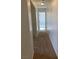 Hallway leading to a bright room with a view of the tub and bathroom at 1742 Franklin Chase Ter, Henderson, NV 89012