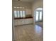 Bright kitchen with white cabinets, countertops, and tile flooring at 1742 Franklin Chase Ter, Henderson, NV 89012