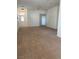 An empty living room with neutral carpet at 1742 Franklin Chase Ter, Henderson, NV 89012