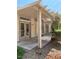 Relaxing covered patio with a pergola, neutral colors, and views of lush landscaping at 1742 Franklin Chase Ter, Henderson, NV 89012