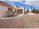 Southwest backyard with desert landscaping and a covered patio, perfect for outdoor entertaining at 2456 Palmridge Dr, Las Vegas, NV 89134