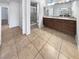 Well-lit bathroom with double vanity, granite countertops, and walk-in shower at 2456 Palmridge Dr, Las Vegas, NV 89134