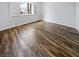 Bedroom showcasing hardwood floors, plantation shutters, and neutral paint, creating a bright and inviting space at 2456 Palmridge Dr, Las Vegas, NV 89134