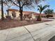 Beautiful single story home with desert landscaping, tile roof, and attached two car garage at 2456 Palmridge Dr, Las Vegas, NV 89134