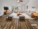 Inviting living room featuring hardwood floors, lots of seating, and ample natural light at 2456 Palmridge Dr, Las Vegas, NV 89134