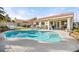 Inviting backyard pool and patio area with beautiful desert landscaping and lush greenery at 266 Corvallis Ct, Henderson, NV 89074