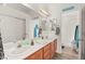 Bright bathroom features double sinks, a large mirror, and a separate shower at 266 Corvallis Ct, Henderson, NV 89074