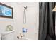 Bathroom features tiled shower/tub with white walls and a shower curtain at 266 Corvallis Ct, Henderson, NV 89074