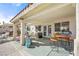 Spacious covered patio area with stylish outdoor furniture, perfect for entertaining guests at 266 Corvallis Ct, Henderson, NV 89074