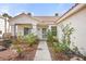 Inviting front exterior with a charming porch, manicured garden, and a walkway to the entrance at 266 Corvallis Ct, Henderson, NV 89074