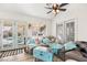 Cozy seating area with a view to the pool and a large sectional couch at 266 Corvallis Ct, Henderson, NV 89074