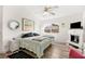 Bright main bedroom with ceiling fan, fireplace, and a view to backyard at 266 Corvallis Ct, Henderson, NV 89074