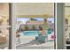 Inviting pool patio area with a view to the sparkling pool, seating, and lovely backyard at 266 Corvallis Ct, Henderson, NV 89074