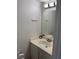 A compact bathroom with a single vanity, large mirror, and essential fixtures for daily convenience at 2692 Matogroso Ln, Las Vegas, NV 89121