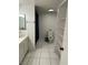 Bathroom featuring a functional layout with storage shelves, a toilet, and a shower at 2692 Matogroso Ln, Las Vegas, NV 89121