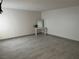 Bright bedroom featuring wood-look floors and a neutral color scheme at 2692 Matogroso Ln, Las Vegas, NV 89121