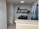 Cozy dining nook adjacent to kitchen with table, chair and decorative shelf at 2692 Matogroso Ln, Las Vegas, NV 89121