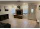 A cozy living room features a brick fireplace and tile floors, perfect for relaxing and entertaining at 2692 Matogroso Ln, Las Vegas, NV 89121