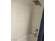 Shower with a shower head and white tiled walls in a bathtub at 2692 Matogroso Ln, Las Vegas, NV 89121