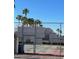 View of a community tennis court with an adjacent residential building behind at 2692 Matogroso Ln, Las Vegas, NV 89121