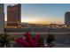 Balcony featuring pink flowers, clear railings, and an impressive view of the Las Vegas skyline at 2747 Paradise Rd # 404, Las Vegas, NV 89109