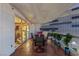 This cozy balcony features terracotta tiling, a table with seating, and potted plants with views of the neighboring building at 2747 Paradise Rd # 404, Las Vegas, NV 89109