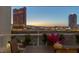 Enjoy breathtaking city views from this amazing balcony featuring a table and chairs at 2747 Paradise Rd # 404, Las Vegas, NV 89109