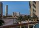 Balcony offers a wonderful view of palm trees, buildings, and the desert landscape at 2747 Paradise Rd # 404, Las Vegas, NV 89109