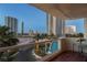 Enjoy an evening on this comfortable balcony with views of nearby palm trees and buildings at 2747 Paradise Rd # 404, Las Vegas, NV 89109