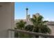 Balcony view of the Stratosphere tower and city buildings framed by lush palm trees at 2747 Paradise Rd # 404, Las Vegas, NV 89109