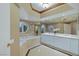 Bright bathroom featuring a large tub, round window, and double sink vanity at 2747 Paradise Rd # 404, Las Vegas, NV 89109