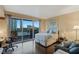 Cozy bedroom with hardwood floors, serene city views, desk, and comfortable seating at 2747 Paradise Rd # 404, Las Vegas, NV 89109