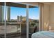 Bedroom balcony offering views of the city's high-rise buildings and picturesque mountains at 2747 Paradise Rd # 404, Las Vegas, NV 89109