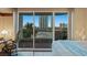 Bright bedroom features a balcony with city views, desk, and wood flooring at 2747 Paradise Rd # 404, Las Vegas, NV 89109