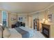 Cozy bedroom featuring a fireplace, desk, shelving unit, and city views at 2747 Paradise Rd # 404, Las Vegas, NV 89109