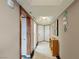 Hallway featuring artwork, decorative lighting and a view of rooms at 2747 Paradise Rd # 404, Las Vegas, NV 89109